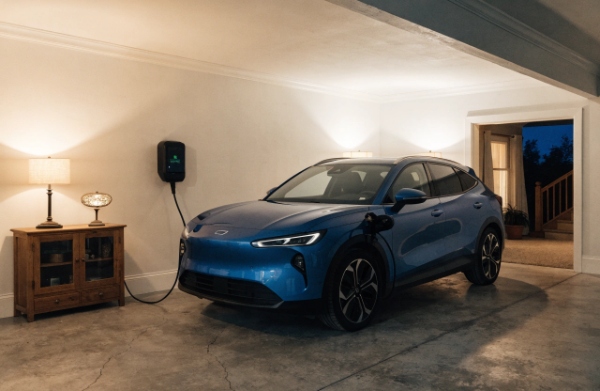 EV charging at home in a residential garage at night, emphasizing convenience and low-cost overnight charging