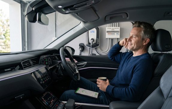 Person safely sitting inside an EV during charging session