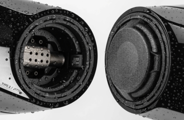 Close-up of EV charging port showing seals and water resistance details